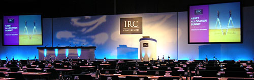 IRC Financial Seminar in London, with two side Screens and Gobo lighting effects across the centre of the set